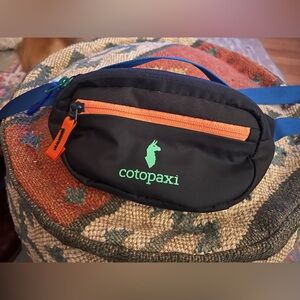 Cotopaxi Black Belt Bag with Orange and Blue Accents